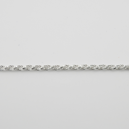 Silver chain on a light gray background