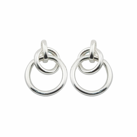 Pair of silver hoop earrings on a white background