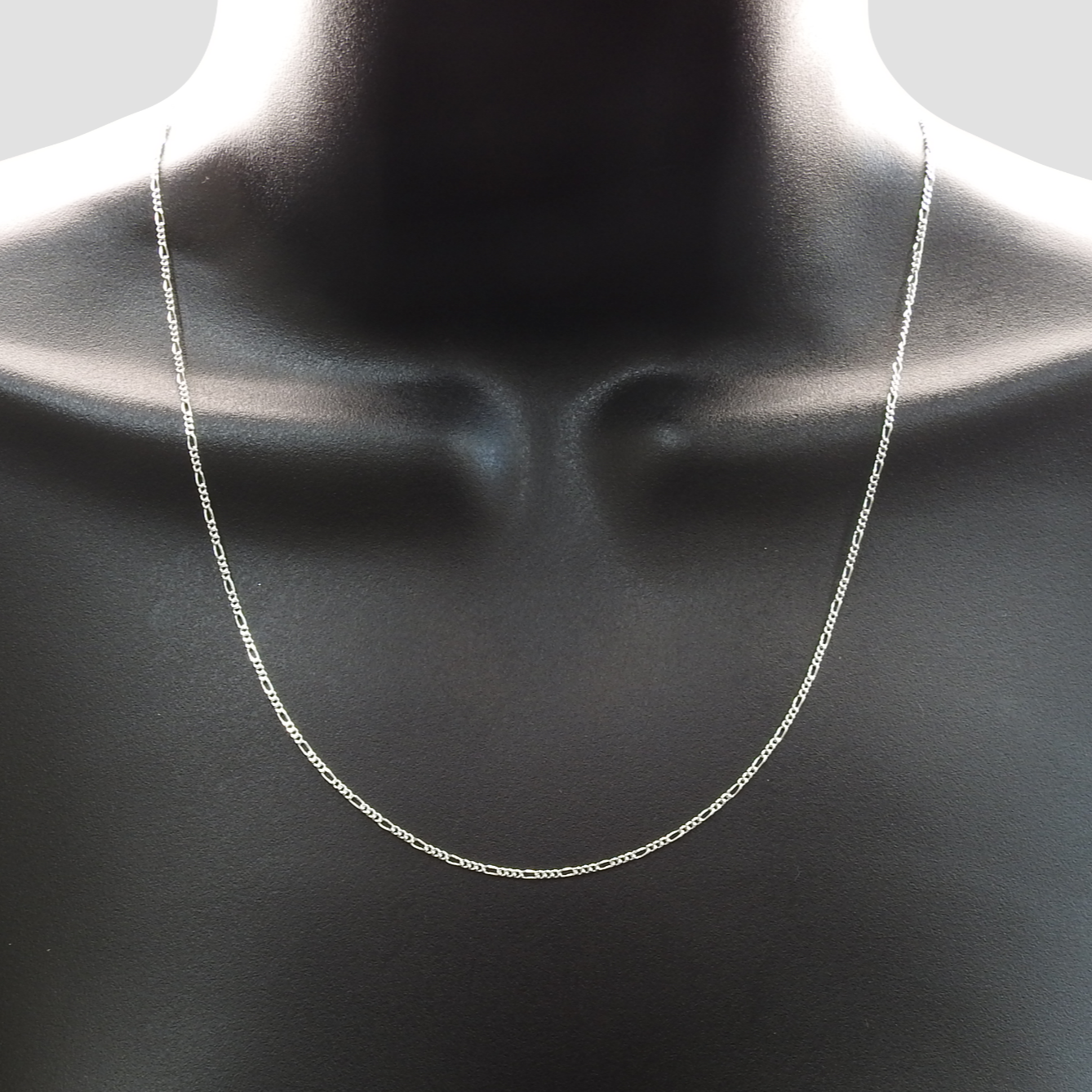 Silver chain necklace on a mannequin neck