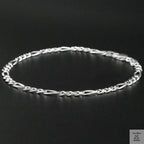Silver bracelet on a black background