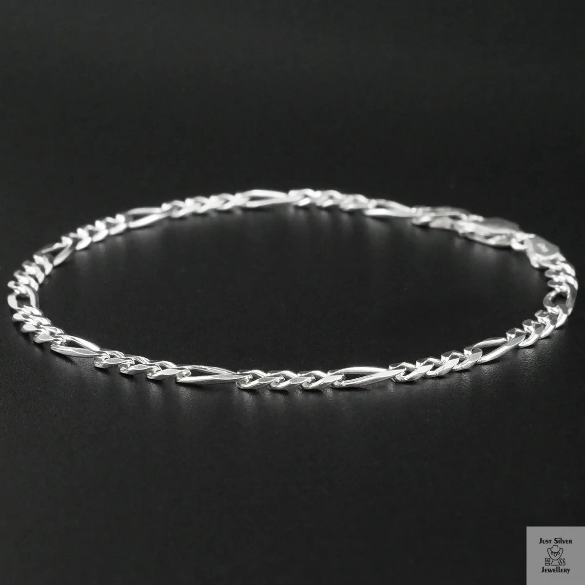 Silver bracelet on a black background