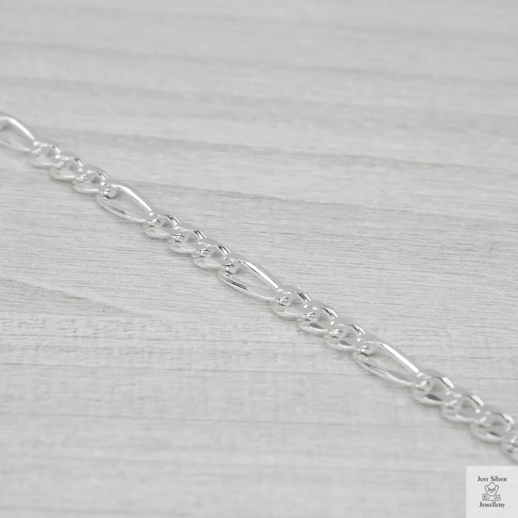 Silver chain on a light grey background