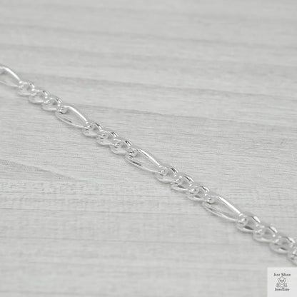 Silver chain on a light grey background