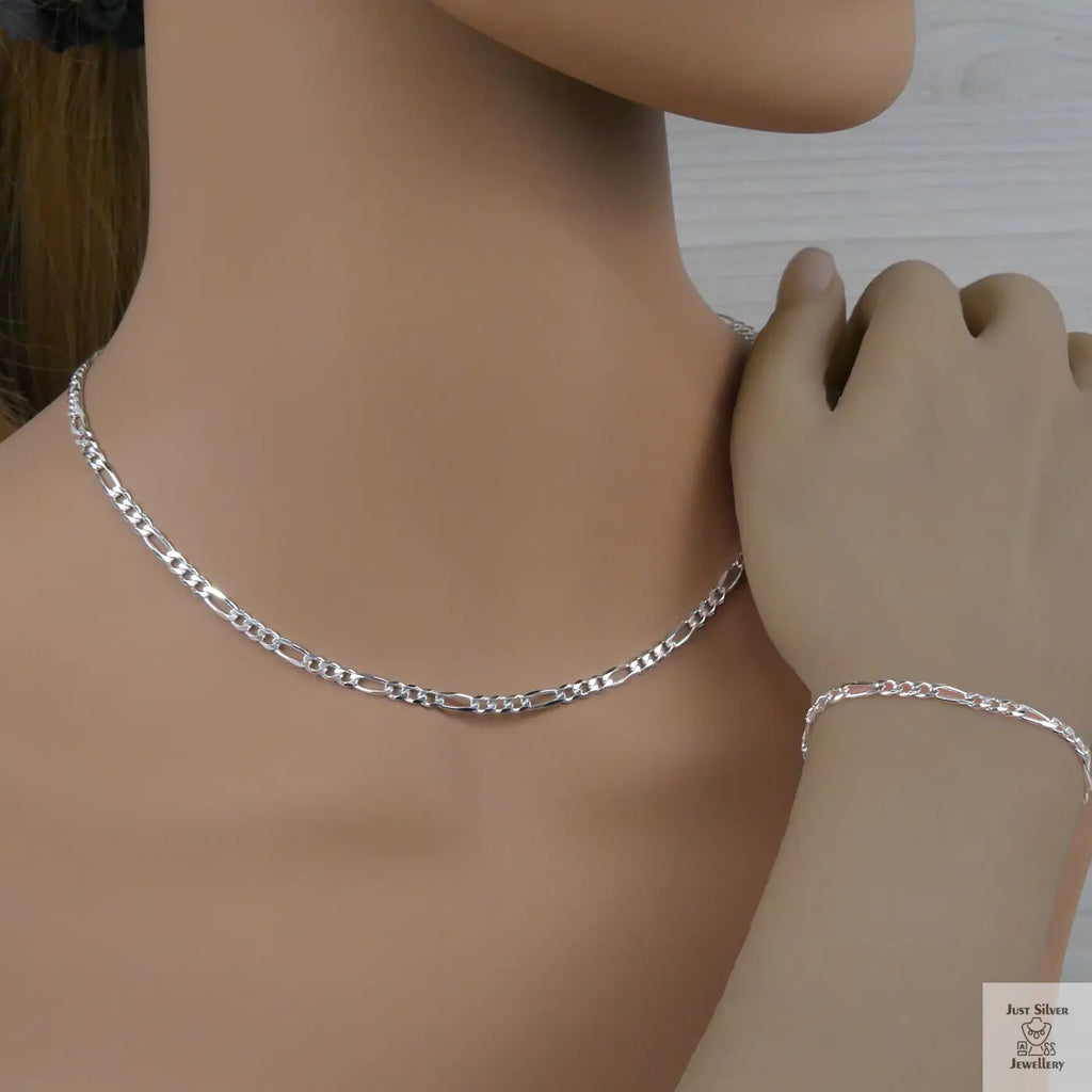 Silver figaro necklace and bracelet on a mannequin