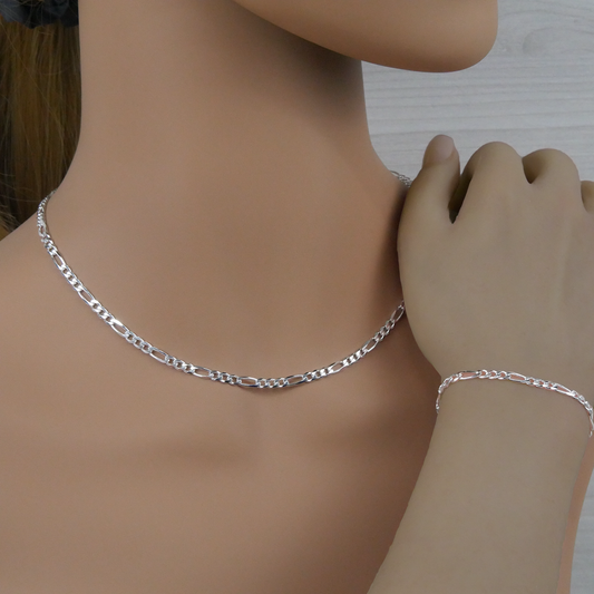 Silver figaro necklace and bracelet on a mannequin