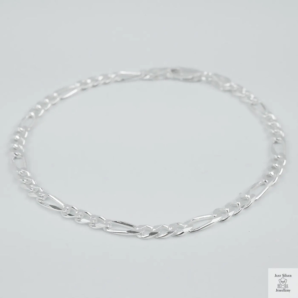 Silver bracelet on a light grey background