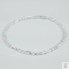 Silver bracelet on a light grey background