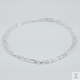 Silver bracelet on a light grey background