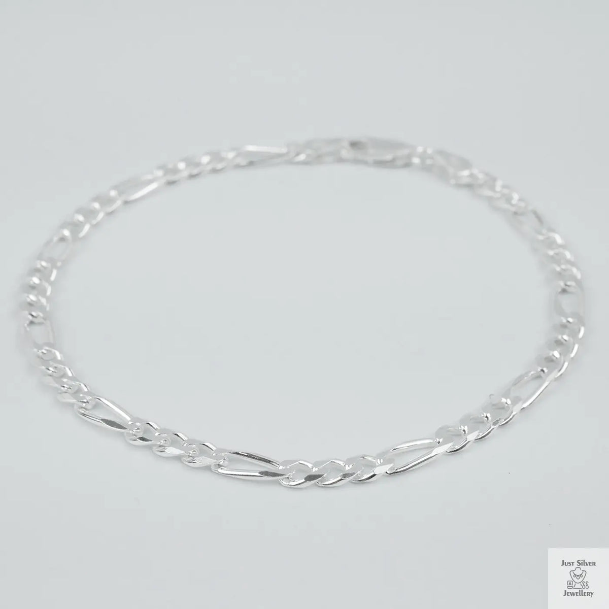 Silver bracelet on a light grey background