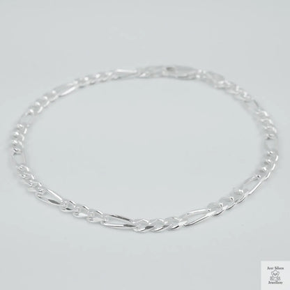 Silver bracelet on a light grey background