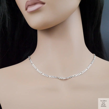 Silver chain necklace on a mannequin with a neutral background