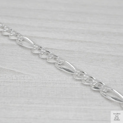 Silver chain on a light grey background