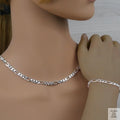 Silver figaro chain necklace and bracelet on a mannequin