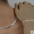 Silver figaro chain necklace and bracelet on a mannequin