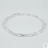Silver bracelet on a light grey background