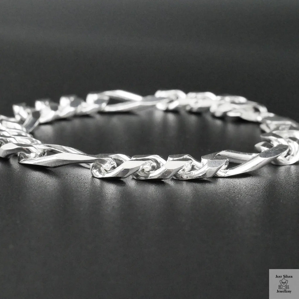 Silver bracelet on a dark surface