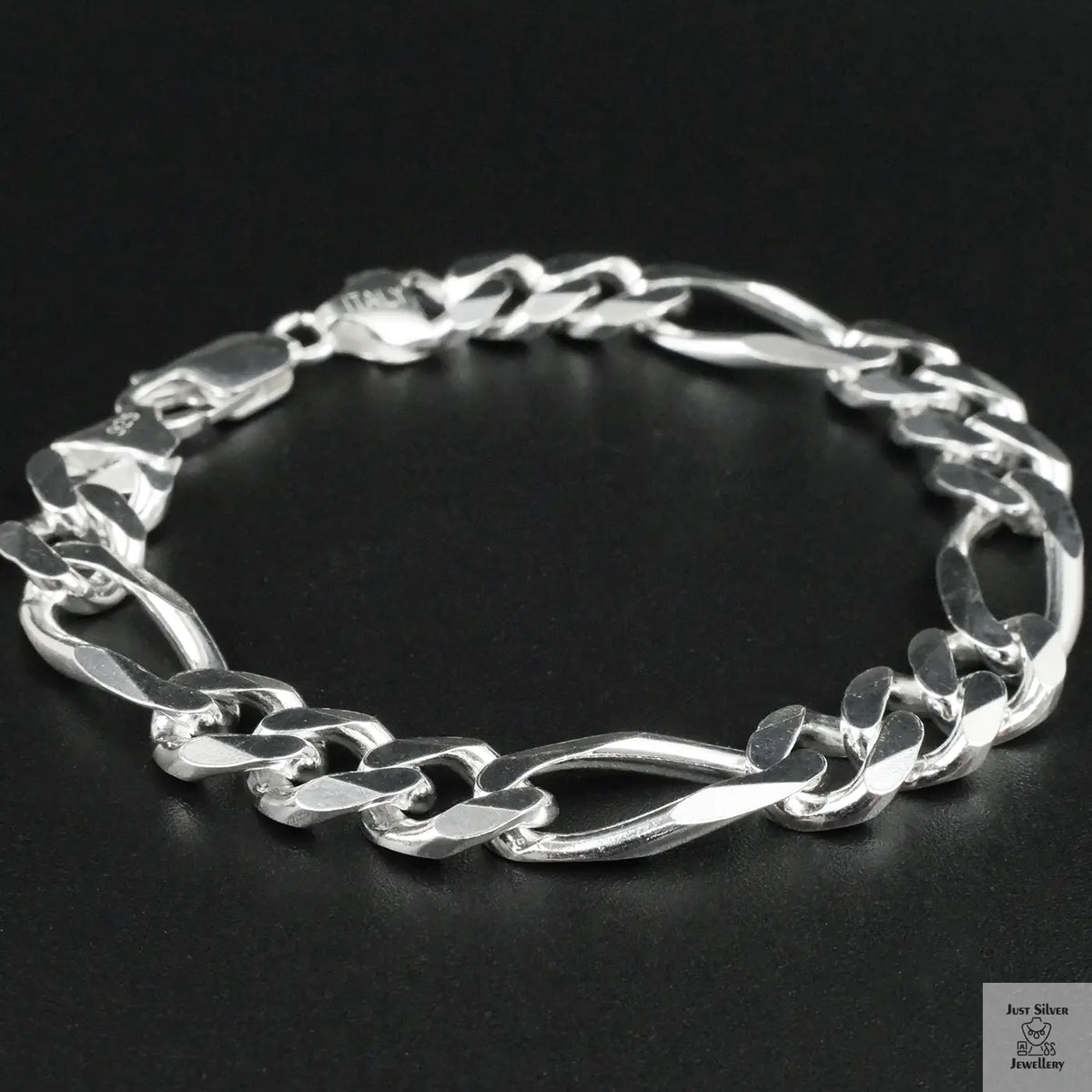 Silver bracelet on a black background