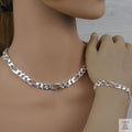 Silver figaro chain necklace and bracelet on a mannequin