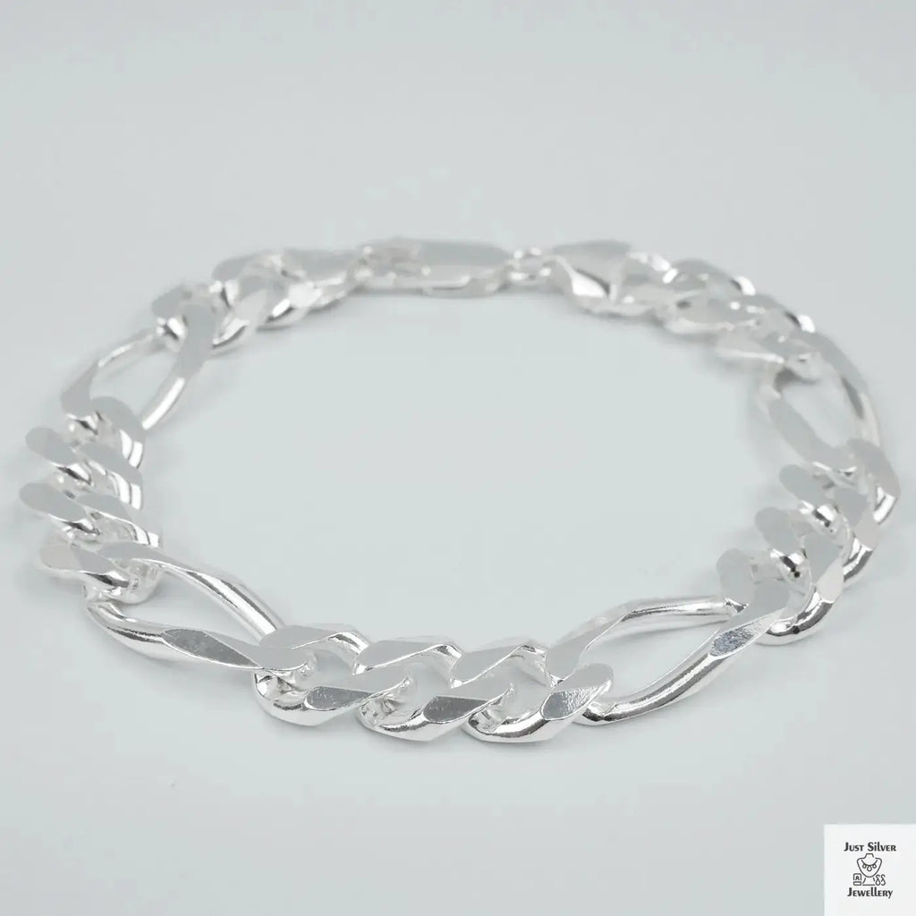 Silver bracelet on a light grey background