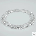 Silver bracelet on a light grey background