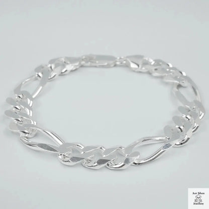 Silver bracelet on a light grey background