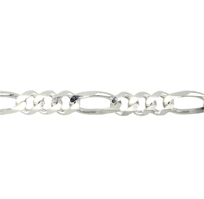 A sterling silver figaro chain necklace laid out on a plain background.
