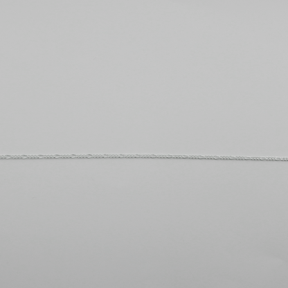 Close-up of a gray fabric with a subtle texture and visible seam.