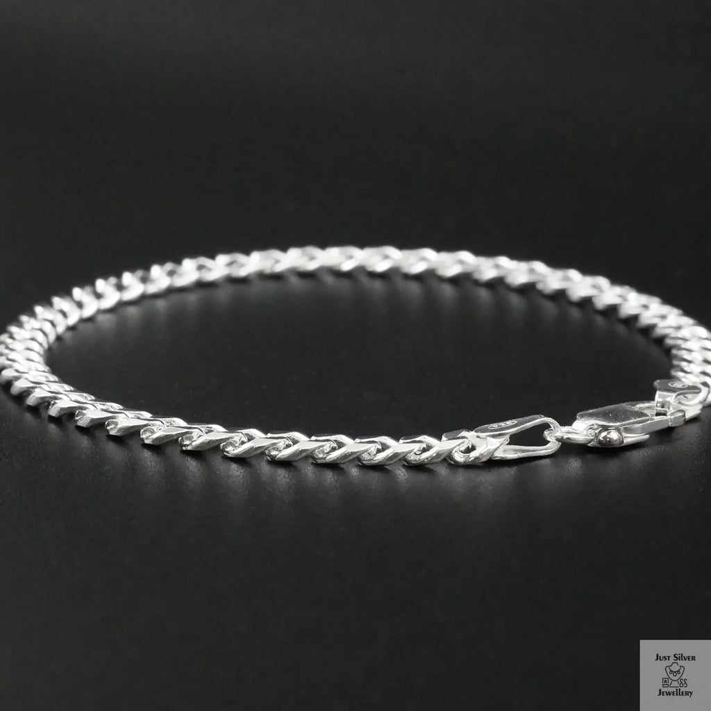 Silver bracelet on a black background