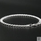 Silver bracelet on a black background