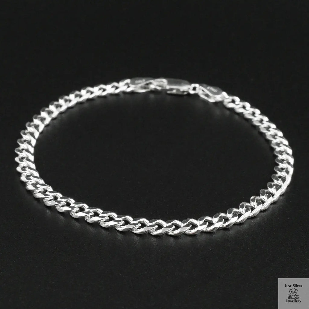 Silver bracelet on a black background