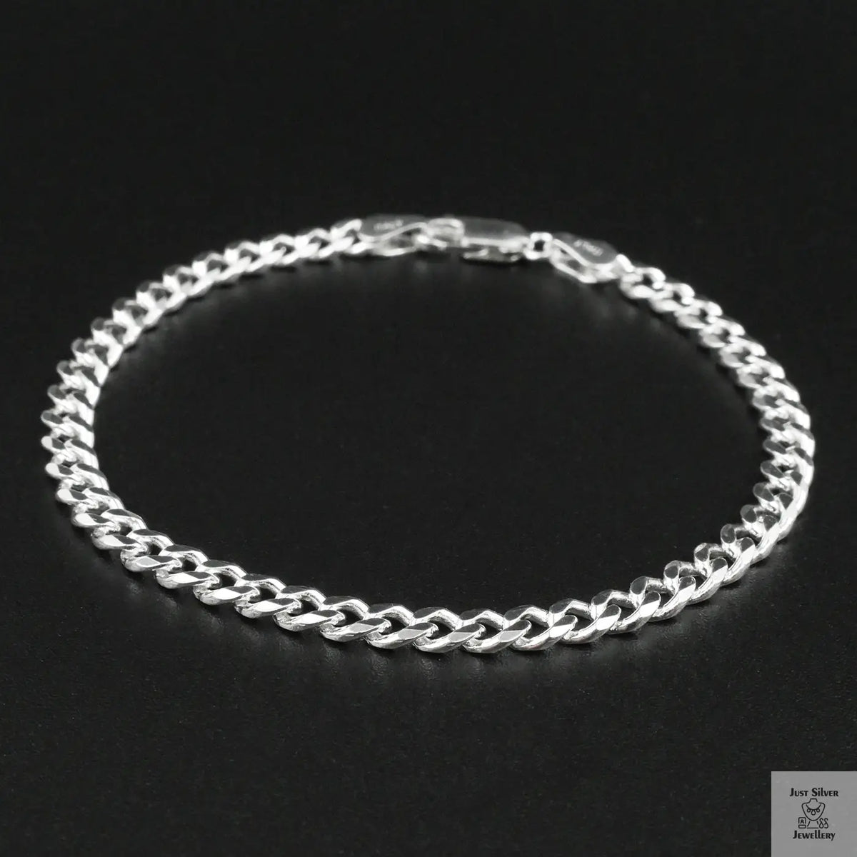 Silver bracelet on a black background
