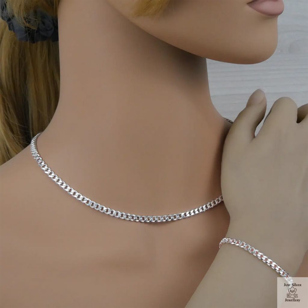 Silver curb chain necklace and bracelet on a mannequin