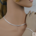 Silver curb chain necklace and bracelet on a mannequin