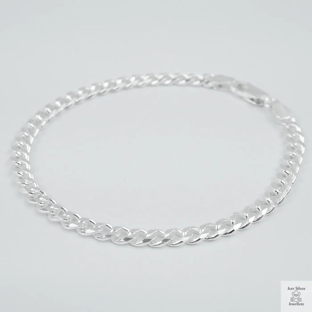 Silver bracelet on a light grey background