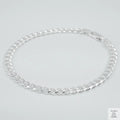 Silver bracelet on a light grey background