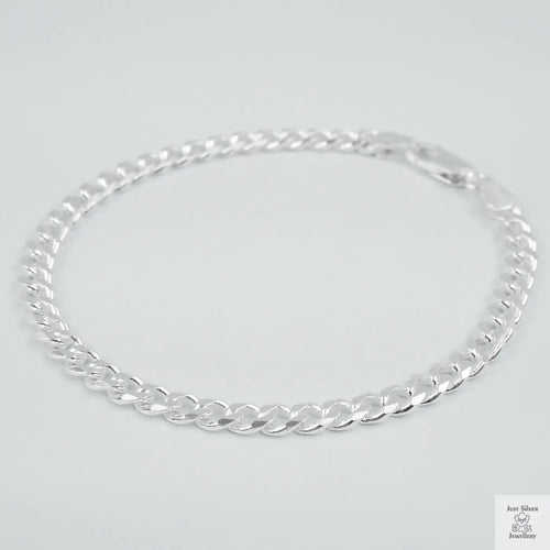Silver bracelet on a light grey background