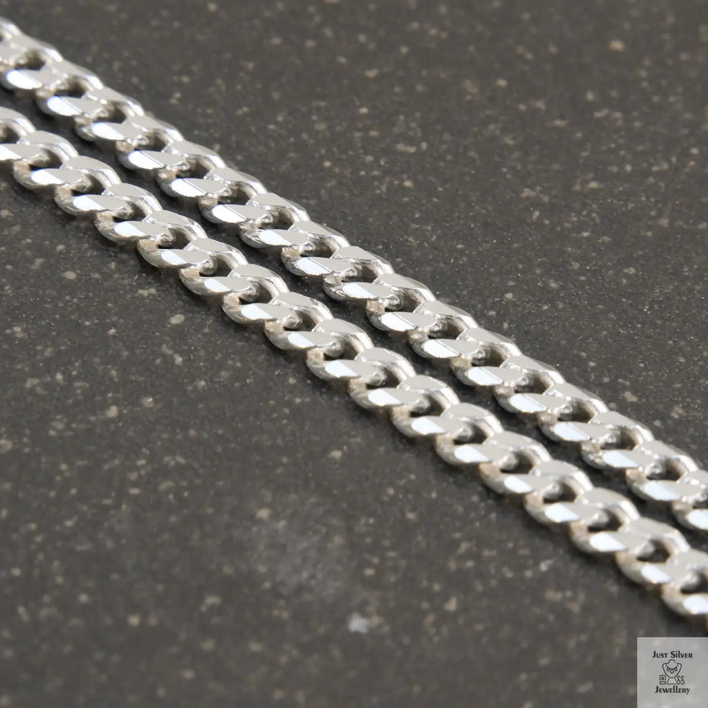 A solid sterling silver curb chain necklace with a 4mm link size, displayed against a white background.
