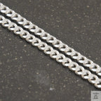 A solid sterling silver curb chain necklace with a 4mm link size, displayed against a white background.