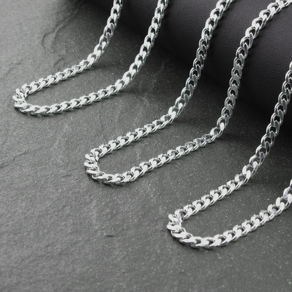 Silver chain on a dark gray surface