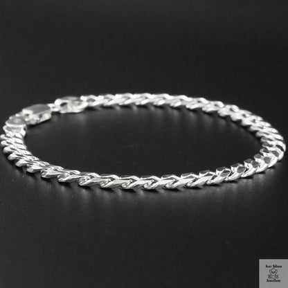 Silver bracelet on a black background