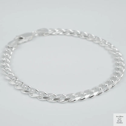 Silver bracelet on a light grey background
