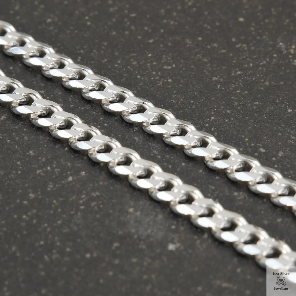 A solid sterling silver curb chain necklace with a 5mm link size, displayed against a white background.