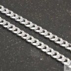 A solid sterling silver curb chain necklace with a 5mm link size, displayed against a white background.