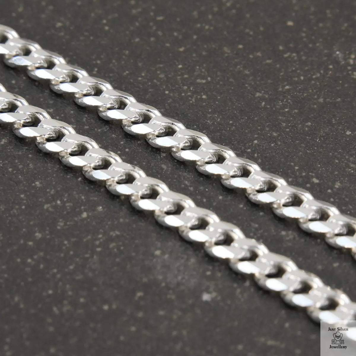 A solid sterling silver curb chain necklace with a 5mm link size, displayed against a white background.