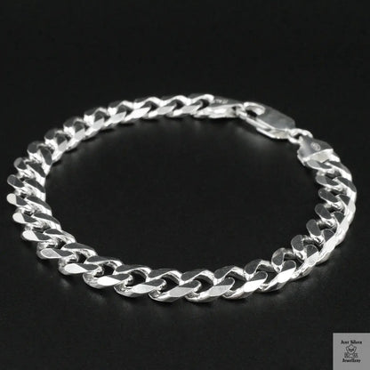 Silver chain bracelet on a black background