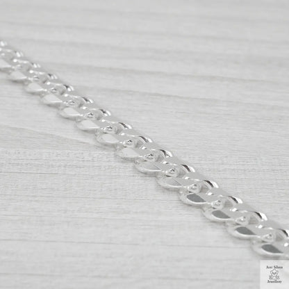 Silver chain on a light grey background