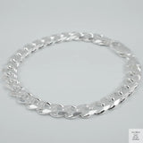 Silver bracelet on a light grey background