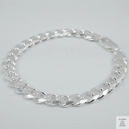 Silver bracelet on a light grey background