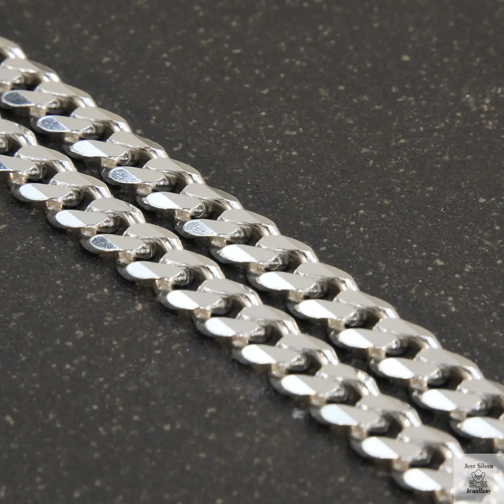 A solid sterling silver curb chain necklace with a 7mm link width, displayed against a white background.