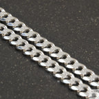 A solid sterling silver curb chain necklace with a 7mm link width, displayed against a white background.